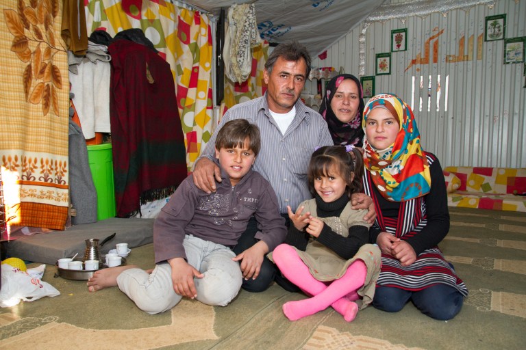 Fatima, 44,  Zakaria, 47, and their children Mohammed, 12, Laynor, 5, and Ghadeer 13, in their shelter in Azraq refugee camp. (Photo: World Vision Canada)
