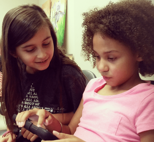 Bianca Loney, 9, and Findley Turnbull, 9 discuss a movie trailer they created at St. Edmund Separate School on Friday, June 17, 2016. (Photo: Kelly Roche/QEW South Post)