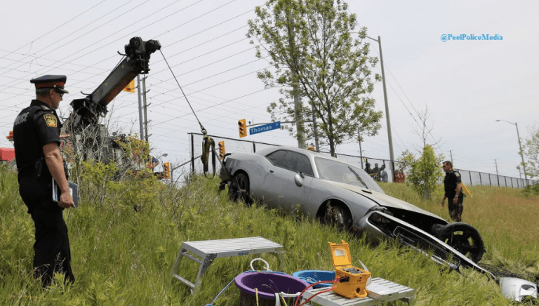A Dodge Charger was pulled from a pond after its driver notified Peel Police on Friday, June 10, 2016. (Photo: Peel Regional Police)