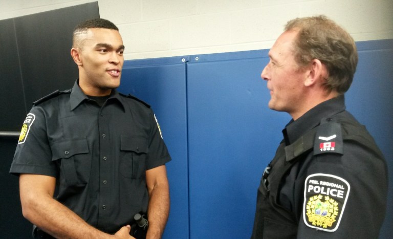 Kyle Woolery, 24, a Peel Police Recruit Constable chats with Const. Mark Fischer during a training session at the Emil V. Kolb Centre on Tuesday, Aug. 30, 2016. “I least look forward to getting tased,” Woolery said, adding he’s most excited to begin his career. (Photo: Kelly Roche/QEW South Post)
