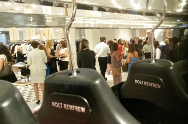 Shoppers attend the grand opening of Holt Renfrew at Square One on Wednesday, July 27, 2016. (Photo: Kelly Roche/QEW South Post)