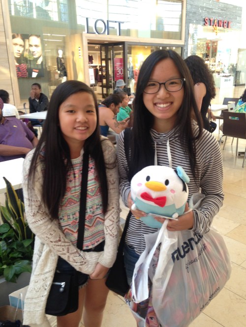 Sisters Grace and Brianna Fan of Richmond Hill pause from back-to-school shopping at Square One to show off their goodies. (Photo: Emma Schatochin/QEW South Post) 