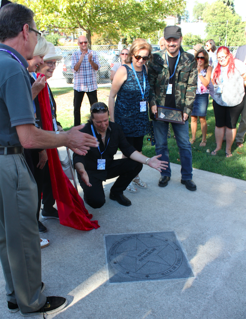 Steve DeMarchi, of Alias fame, unveils his star along the Mississauga Music Walk of Fame on Sunday, Sept. 11, 2016. He was one of four inductees honoured at the 5th annual event. (Photo: Emma Schatochin/QEW South Post) 