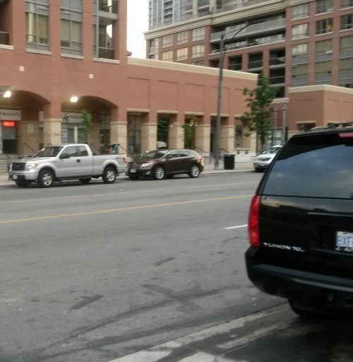 A GMC Yukon is parked along Burnhamthorpe Rd. in downtown Mississauga. The  Yukon is listed three times in the Insurance Bureau of Canada's 2016 list of most stolen vehicles in Ontario. The rankings are released annually. (Photo: Kelly Roche/QEW South Post/file)