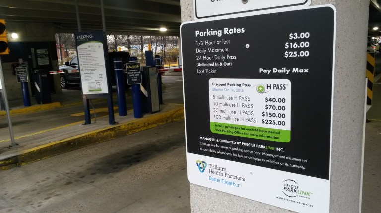 Parking rates are displayed at Trillium's Cooksville campus. (Photo: Kelly Roche/QEW South Post)
